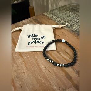 The "Pop Pop" bracelet from
Little Words Project for men in
black.